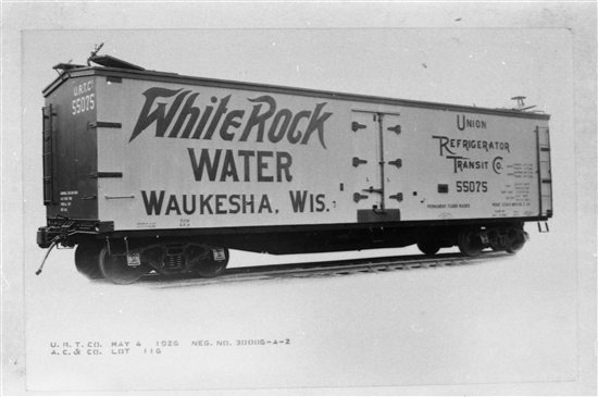 1926 photo of a United Refrigerator Transit car built by American Car & Foundry, with a White Rock Water advertisement on its side